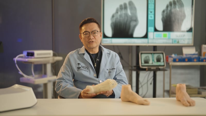 Dr. TJ Ahn holding the Cadara Foot